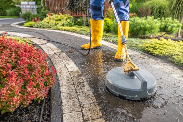man-doing-pressure-washing-with-a-boots