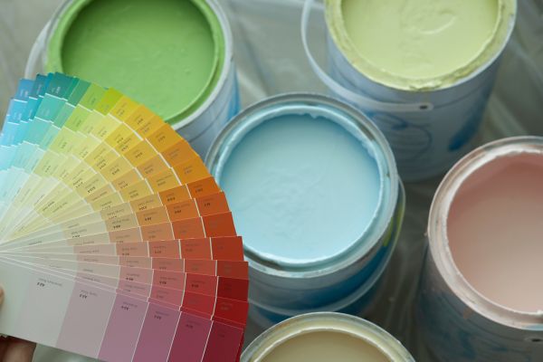 different kinds of paint in can with a color pallette