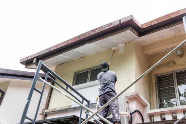 man-painting-homes-exterior